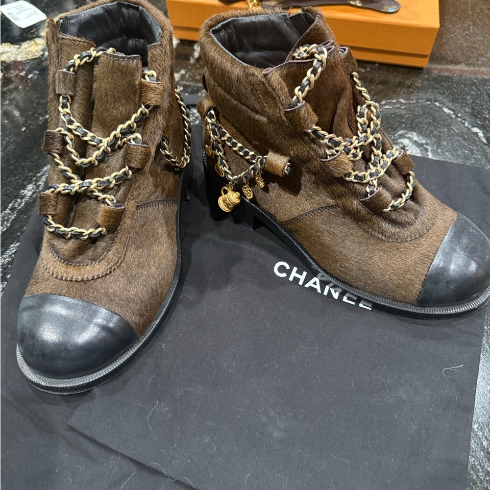 Authentic CHANEL ponyhair booties with charms. Size 37. Good condition.